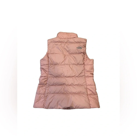 The north face 
Pink puffer vest 
Pilling on inside, Small stains on front - Picture 2 of 9